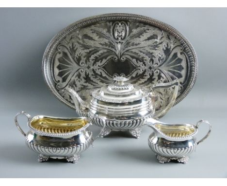 A CLOSELY MATCHED GEORGIAN SILVER TEA SERVICE with gadrooned bodies, the teapot hallmarked London 1822 by William Bateman, th