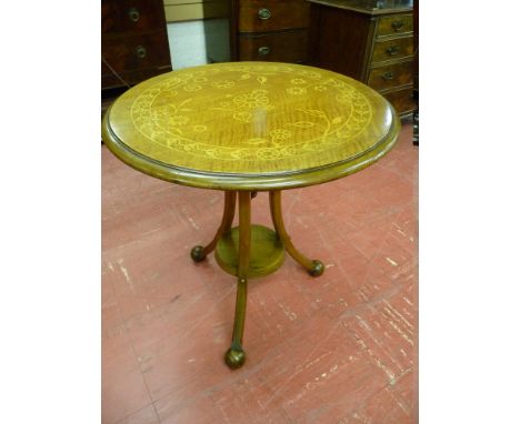 A HOWARD & SONS INLAID WALNUT TABLE, the 56 cms diameter circular top satin wood inlaid with a continuous band of stylized fl