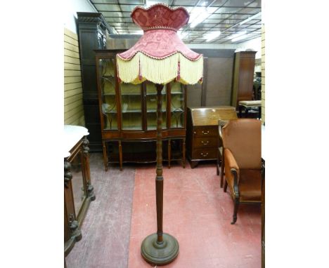 A VINTAGE MAHOGANY STANDARD LAMP and classically styled tasselled edge shade