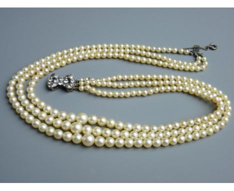 A TRIPLE STRAND CIRO PEARL NECKLACE, boxed