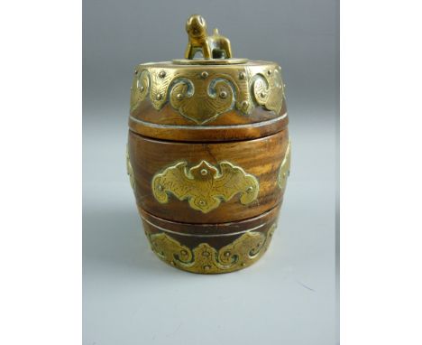 AN ORIENTAL HARDWOOD BARREL SHAPED CONTAINER in three parts with temple lion finial, central bat shaped plaques and further b