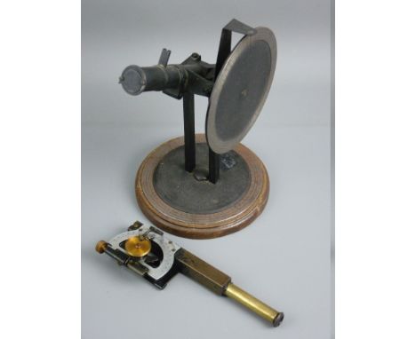 A VINTAGE MONOCULAR SCOPE ON STAND with multi-swivel action and pointers (possibly for calibrating directional height), 23 cm
