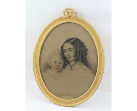 VICTORIAN BRITISH SCHOOL A portrait of a mother and child, her hair in ringlets, a Pastel drawing, 33cm x 25cm in oval gilt f