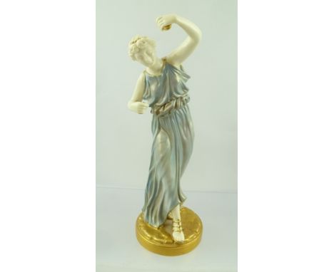 A ROYAL WORCESTER PORCELAIN FIGURE of a young woman dancing, wearing a blue classically draped dress, revealing gilded sandal