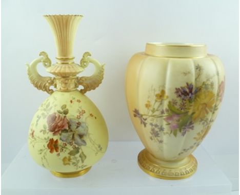 A ROYAL WORCESTER VASE, having fluted trumpet neck above a green man mask band with acanthus shoulder handles, tear drop body