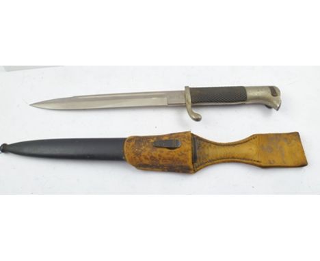 A GERMAN WORLD WAR II BAYONET with scabbard and hanger/frog, made by Carl Eickhorn Solingen, circa 1936-1941 