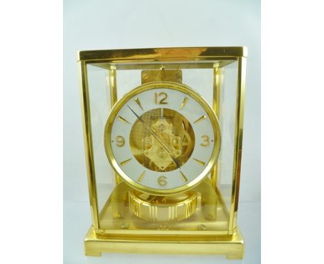 A JAEGER-LE COULTRE ATMOS CLASSIC TIMEPIECE, having brass glazed frame, the chapter ring dial with Arabic numerals at the qua