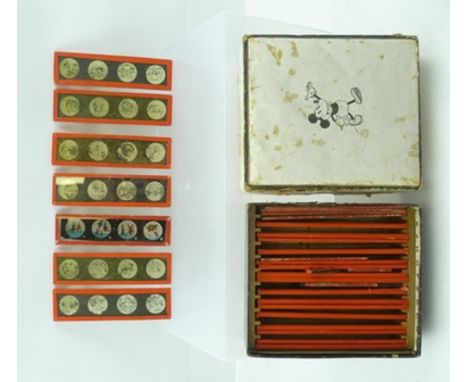 A MICKEY MOUSE CASED SET OF MAGIC LANTERN SLIDES, each slide has four images, 13cm x 3.5cm, the box has "Mickey Mouse" image 