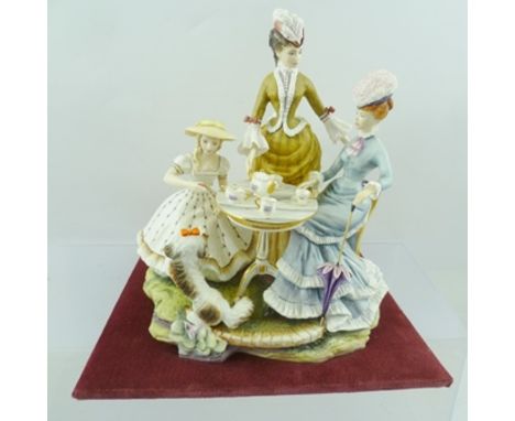 A ROYAL WORCESTER BONE CHINA FIGURE GROUP "The Tea Party", 1964, part of the Victorian series, on velvet pad base, 21cm high 