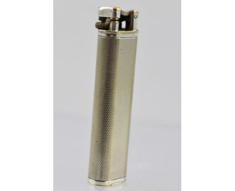 AN ELECTRO-PLATED "DUNHILL" POCKET LIGHTER, having engine turned decoration, 7cm high 