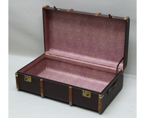 AN EDWARDIAN WOODEN HANDED, BRASS MOUNTED, TRAVEL TRUNK, bears early printed paper labels, "B.O.A.C.", "Aden Airways" etc., 9