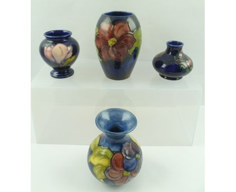 A MOORCROFT CERAMIC BALUSTER VASE, piped and hand painted "Clematis" design, bears paper label to base "... Potter's to The L