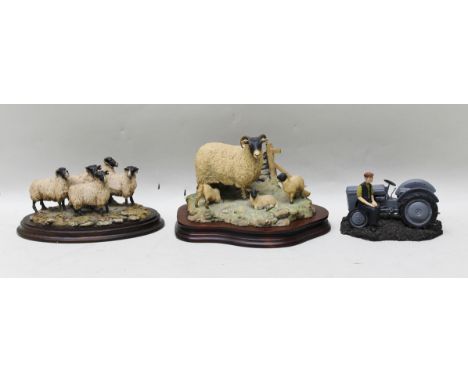 BORDER FINE ARTS MADE IN SCOTLAND A modelled figure of ewe & lamb and three lambs aside a drystone wall on a shaped wooden ba