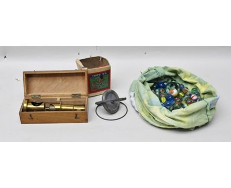 A COLLECTION OF GLASS MARBLES, a Top Toys Gyroscope top in remains of original vendor's box and a Junior Brass Microscope in 