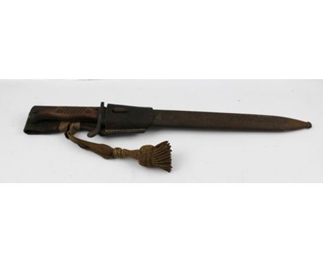 A WORLD WAR I GERMAN BAYONET with wooden handle grips, a scabbard, frog and knot, blade inscribed "V.C. Schilling Suhl", frog