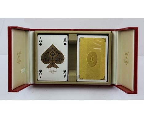 A "LES MUST de CARTIER" CASE CONTAINING TWO PACKS OF PLAYING CARDS, circa 1974 