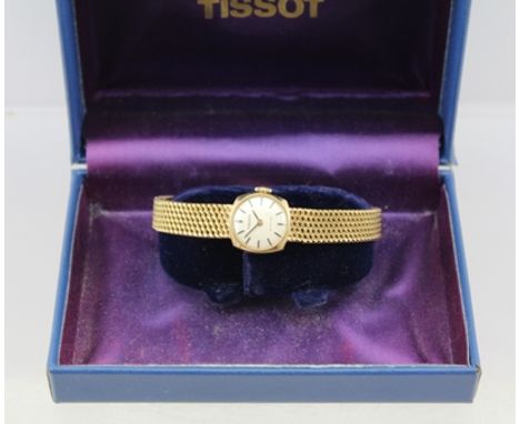 A "TISSOT" 9CT GOLD CASED LADY'S WRIST WATCH with 9ct gold strap, 17-jewel movement, in presentation box 