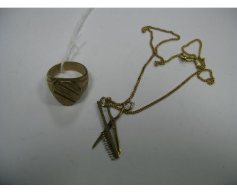 A Novelty 9ct Gold Pendant, as a pair of scissors and comb, on 9ct gold chain*The gent's ring has been removed from this lot.