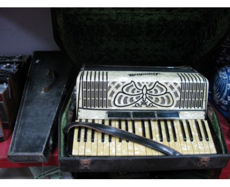 A Ferdinando Lapini Napoli Mandolin, with butterfly inlay brown sound box, (cased), a Scandalli 'Butterfly Mopel' accordion w