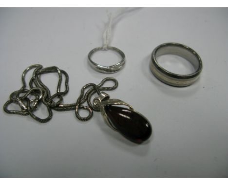 A Diamond Set Ring, stamped "PT950" "0.10", together with a titanium gent's ring and a pendant on chain. 
