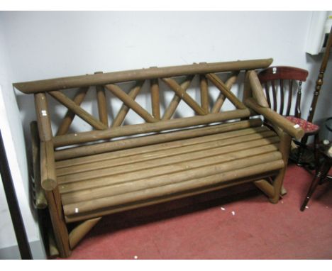 A Brown Painted Garden Bench, with an 'X' shaped back. 