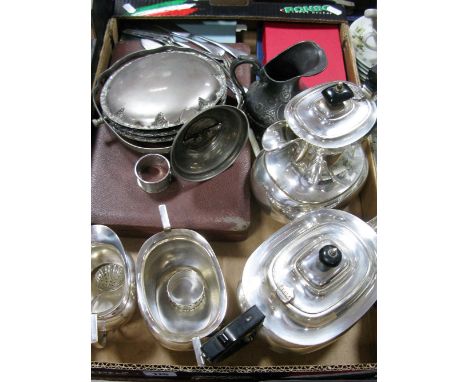 A Four Piece Electroplated Tea Service of Cushioned Oval Form, ebonised spur capped handles and finial, a silver hallmarked n