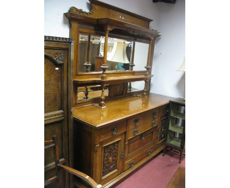 A XIX Century Oak Mirror Back Sideboard, with twin pillars, three bevelled mirrors and pokerwork panel over base having twin 