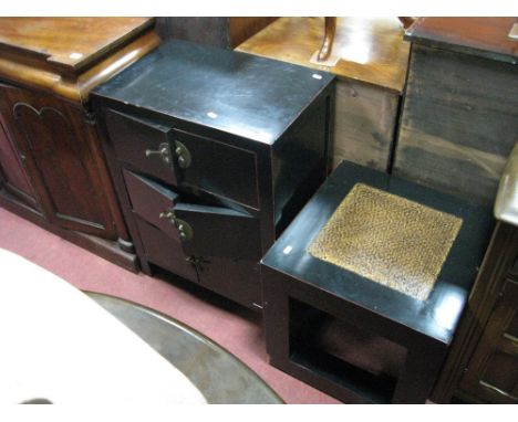 An Oriental Style Black Lacquer Cabinet, with three cupboards, with brass locks, together with a black lacquer lamp table.