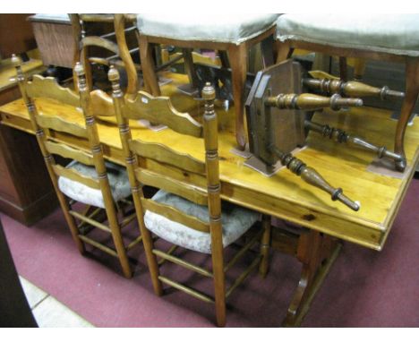 A XX Century Pine Refectory Table, with a rectangular top, on trestle supports; together with four a ladder back chairs.