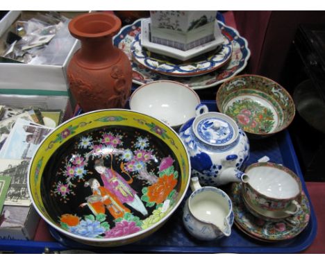 A Japanese Bowl, of circular form painted in multicoloured enamel, with figures in a garden, within a yellow border, 24.5cm d