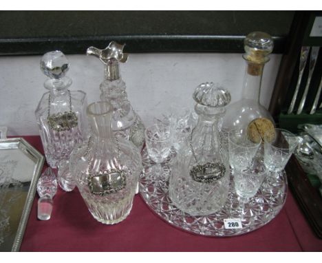 A Hallmarked Silver Mounted Cut Glass Stoppered Decanter, with triple spout; together with three further decanters, all with 