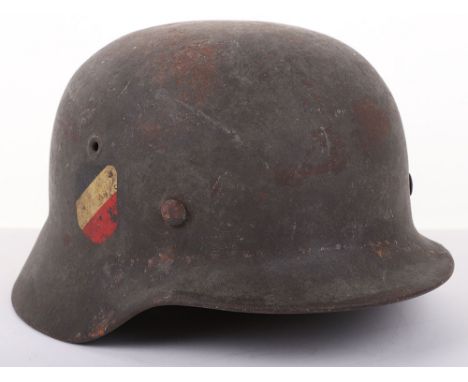 UNTOUCHED WWII GERMAN M-40 DOUBLE DECAL STEEL COMBAT HELMET, a superb untouched as found example of a M-40 pattern steel comb