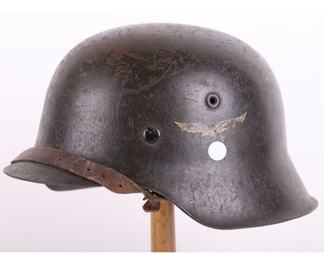 WWII GERMAN LUFTWAFFE M-42 STEEL COMBAT HELMET, good example of a standard M-42 steel combat helmet with a dark black painted