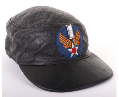 AMERICAN WWII USAAF CAP, commercial example, made of black leather w/ black leather visor, has a black cloth quilted lining w