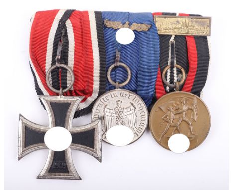 GERMAN WWII ARMY 3-PLACE MEDAL BAR, an Iron Cross 2nd class, a 4 year Army Service medal w/ eagle on ribbon, & “Oktober 1938”