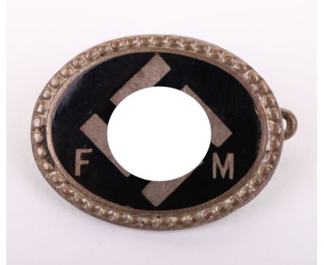 SCARCE SS DONORS PIN, an oval black enamel w/ elaborate silver edging, is  ¾” wide, a tilted swastika design w/ double runics