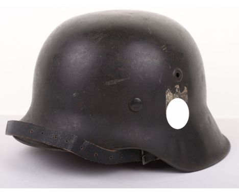 WWII GERMAN ARMY SINGLE DECAL M-42 STEEL COMBAT HELMET, good example retaining its dark combat paint finish to the shell. Hel