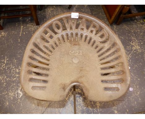 A HOWARD CAST IRON TRACTOR SEAT ON STOOL SUPPORT. 