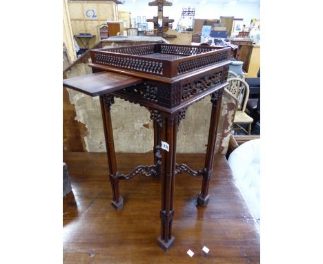 A CHIPPENDALE STYLE HARDWOOD URN STANT WITH CUP SLIDE. 