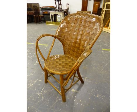 A WOVEN SPLIT WALNUT AND RUSTIC BENTWOOD ELBOW CHAIR, THE HOOP BACK AND CIRCULAR SEAT OF WOVEN LATHS, THE SWERLING OPEN STICK