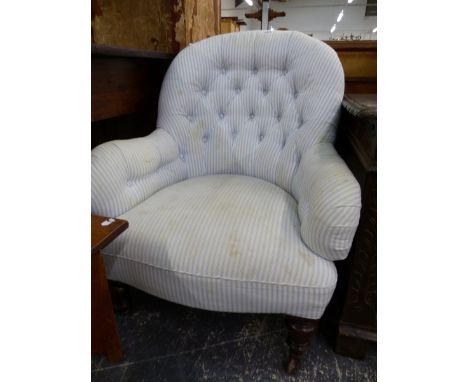 A VICTORIAN BUTTON BACK LADIES ARM CHAIR. 