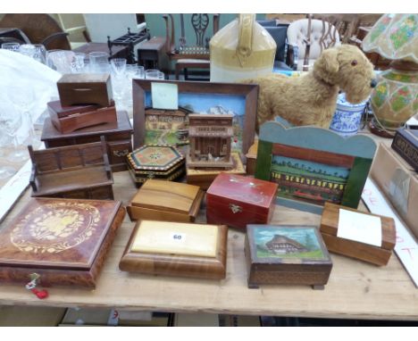 A COLLECTION OF VARIOUS WOODEN TRINKET BOXES TO INCLUDE SOME WITH MUSICAL MOVEMENTS, A SWISS DIORAMA, AND A PLUSH VINTAGE DOG