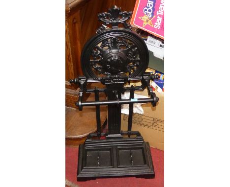 A contemporary black painted cast iron twin division stick stand, in the Victorian Coalbrookdale taste, width 42.5cm