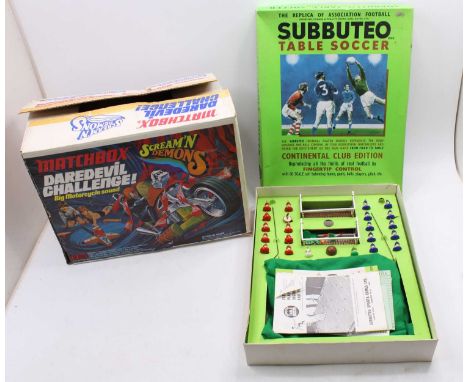 A Matchbox Dare Devil Challenge Screamin Demons play set in its original box together with a Subbuteo Table Soccer Club Editi