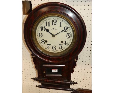 A simulated rosewood drop trunk wall clock