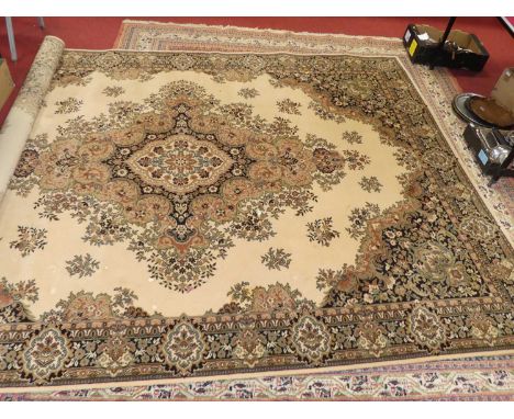 A Persian style cream ground woollen tabriz rug, machine woven, European manufacturedSome staining and marks throughout.Some 