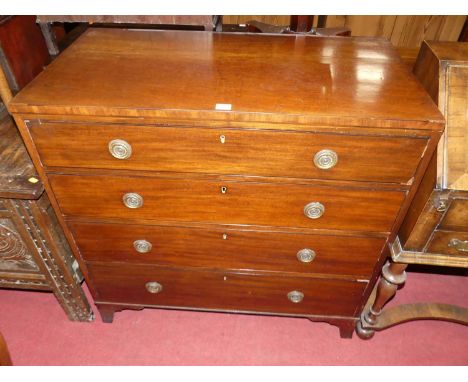An early 19th century mahogany caddy chest, of four long graduated drawers, w.91cm