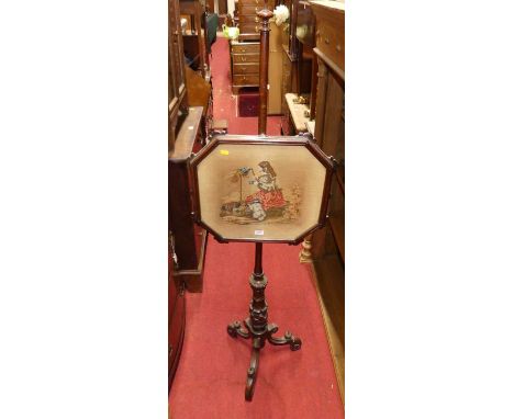 A mid-Victorian carved mahogany needlework tapestry inset pole screen