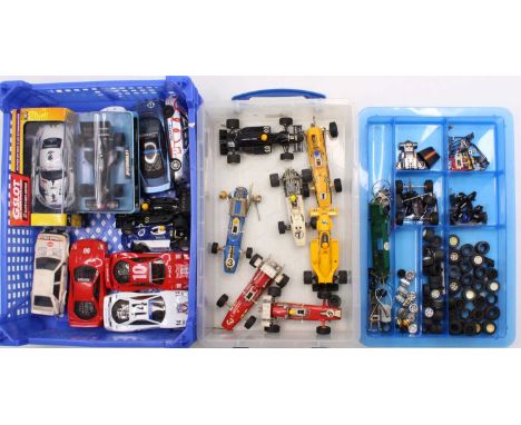 A collection of vintage Scalextric slot cars and spare parts including a boxed JPS Formula 1 Racing Car, a selection of motor