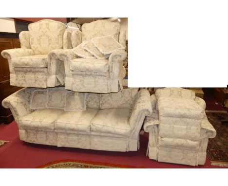 A contemporary floral cream fabric upholstered four-piece suite, comprising; a three-seater sofa, w.245cm, three armchairs, e